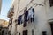 Ancient White Street with clothes hanging to dry in Ostuni, Puglia, Italy