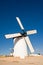 Ancient windmill in Campo de Criptana (Spain) with the blades covered by a cloth ready to go into operation