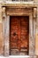 Ancient wood door of a historic building in Perugia (Tuscany, Italy)