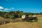 Ancient wood wagon on hill top with dry bushes