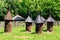 Ancient wooden beehives in old rural apiary