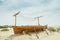 Ancient wooden boat on the sand in the desert