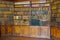 Ancient wooden book shelves with old library books Dusty bookshelf with rare books collection in bookcase Retro library