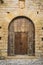 Ancient wooden door of a castle in Peratallada, Spain