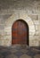 Ancient wooden door in old stone castle in Guimaraes