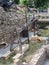 Ancient wooden mill with stone millstone in archaeological museum