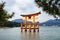 Ancient wooden torii gate in middle sea of unesco world heritage