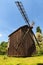 Ancient wooden windmill. Typical ancient building in Ukrainian village. Pereyaslav-Khmelnitsky Museum of Folk Architecture.