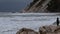 Ancona - Italy - November 25 2019 - Wave surfing during a sirocco storm in autumn in Portonovo bay