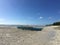 Anda beach during low tide with a Catamaran boat