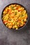 Anda Bhurji is an Indian Style Spicy Scrambled Eggs closeup in the plate. Vertical top view