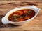 Anda Masala or Egg Curry is popular indian spicy food, served in a ceramic bowl over rustic wooden background. Selective focus