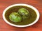 Anda Masala or Egg Curry is popular indian spicy food, served in a ceramic bowl over rustic wooden background. Selective focus