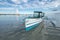 Anda, Pangasinan, Philippines - A small outrigger boat used to ferry tourists docked near the beach