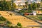 Andalusia region, Spain. Elevated View Of Rural Landscape Field With Hay Bales Rolls