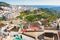 Andalusian white village on a hill and overlooking the blue sea in the background. Frigiliana Malaga.