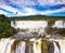 Andean condors fly over waterfalls Iguazu