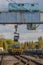 Andernach, Rhineland Palatinate, Germany - October 25, 2019: a big crane bridge lifting a metal coil to load it onto a waggon