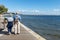 Andernos, Arcachon Bay, France. A retired couple on the seaside promenade