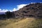 Andes mountain range Apurimac dirt road with a footprint in a wild, dry place without trees and rocks without people