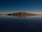 Andes mountains sunrise panorama mirror reflection on Salar de Uyuni salt flat lake in Potosi Bolivia South America