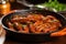 andouille sausages sizzling in a red pan