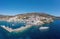Andros island Batsi village Cyclades Greece. Aerial drone view of port, breakwater yacht, sea sky