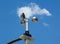 anemometer wind speed indicator measuring device under blue sky and clouds