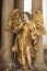 Angel, beautiful angel statue with golden wings and dragon in St. Peters Church, Munich