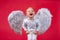 Angel child boy with white wings laughing. Excited angelic children is laugh. Cute excited kid with white wings