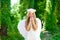 Angel children girl smelling pinks flower