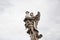 Angel with column ancient marble statue architectural sculpture historical landmark in Rome, Italy