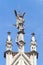 The angel defeating the dragon is the top of the spire of the facade of the Roman Catholic Cathedral of St. Nicholas in Kyiv.