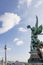 The angel of the dome of the Cathedral of Berlin, Germany and the Television Tower against a beautiful blue sky with some clouds