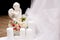 Angel figurine with wedding candles and roses