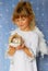 Angel girl holding christmas ball in hand