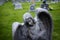 Angel Headstone In Graveyard Green Grass