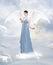 Angel with lyre on the cloud