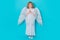 Angel prayer. Cute angel child, studio portrait. Angel kid with angels wings, isolated background.