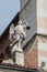 Angel statue on the facade of Cremona Cathedral, Italy