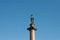 Angel statue holding cross in St. Petersburg with moon