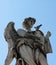 Angel with the Whips sculpture in Rome Italy with pigeon resting on his shoulder.