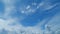 Angel wing shaped cloud and cumulus against blue heaven. Cirrus clouds in blue sky. Panoramic skyscape. Timelapse.