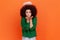 Angelic woman with Afro hairstyle wearing green casual style sweater and nimbus over head sending