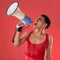 Anger, gay and a man with a megaphone for protest isolated on a red background in a studio. Lgbt, freedom and person