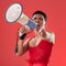 Anger, gay and portrait of a man with a megaphone isolated on a red background in a studio. Decision, freedom and person