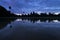 Angkor Wat and blue sky reflected in the lake at sunrise, view of popular tourist attraction ancient temple in Siem Reap, Cambodia