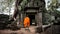 Angkor Wat monk. Ta Prom Khmer ancient Buddhist temple in jungle