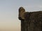 Angle tower of Budva citadel during sunset.