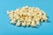 Angle view popcorn on a blue background